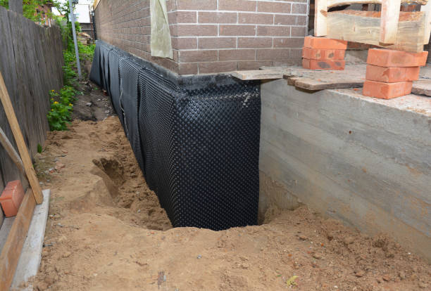 Happy homeowners after waterproofing job in Oakdale